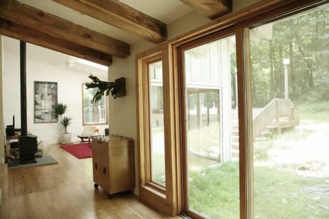 From kitchen. Vintage bar contains cocktail glasses and shaker.
