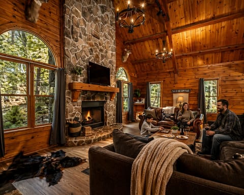 Updated log cabin, with 8 bedrooms, spacious living spaces, and upgraded & comfortable features.