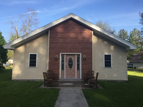 Front of the house with seating and table 