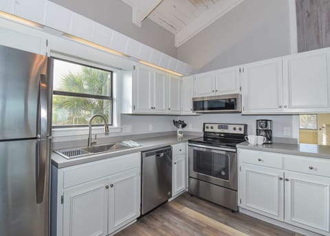 Kitchen with white cabinets and stainless steel appliances