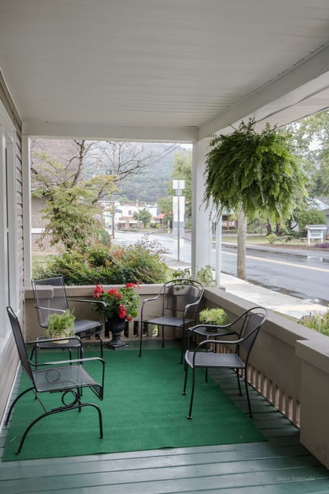 Spacious front porch for visits or observing town life go by