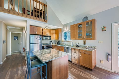 Kitchen with hallway leading back to main level bedrooms