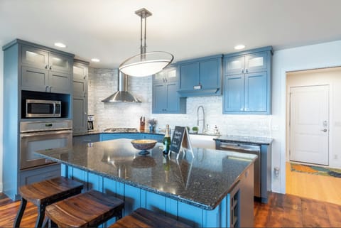 Huge granite island is a popular gathering place!