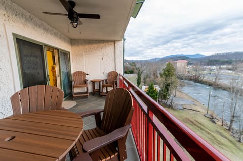 Deck with balcony height table with 4 chairs that swivel. 