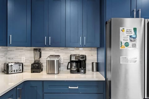 Large Beautiful Kitchen Recently Renovated with Beautiful Coastal Blue Cabinets, Quartz Countertop, Stainless Steel Appliances, Farm Sink and Tons Of Storage