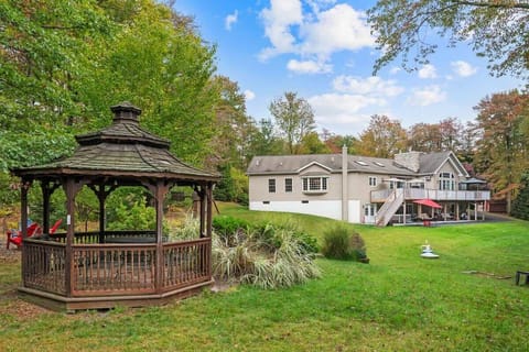 Enjoy our beautifully landscaped outdoor space.  Firepit, horseshoes, cornhole....private 2.5 acres.