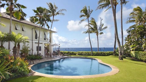 Hale A Kai at Poipu - Heated Oceanfront Swimming Pool with Large Lawn.jpg