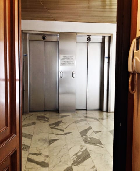 Elevators in front of the entrance door
