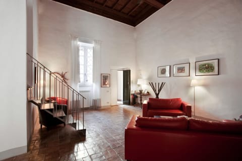 the large entrance and the living and the stairs to upstairs.