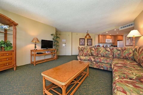 Relax in the inviting living room, complete with a comfortable L-shape sleeper sofa