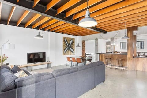 Experience the spacious and light-filled living room, perfect for relaxing after a day exploring the city. 