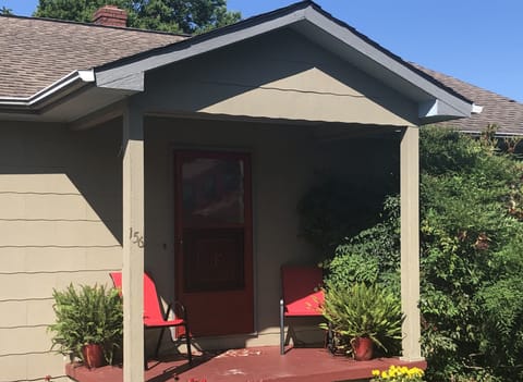 Front entrance,  a side porch entrance and an entrance from backyard to basement