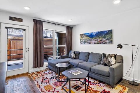 Cozy living space with plenty of space to lounge, curl up with a book, or enjoy the outside views.