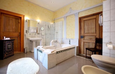 Shower, hair dryer, slippers, towels