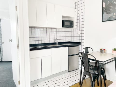 Deluxe Bungalow, Multiple Beds, Kitchen | Private kitchen | Fridge, microwave, stovetop, electric kettle