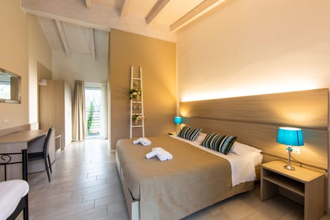 Superior Double Room, Pool View | Minibar, in-room safe, desk, laptop workspace