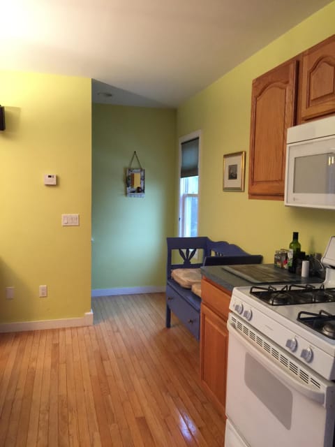 From the kitchen area you get to the stairs that lead to second & third floors.