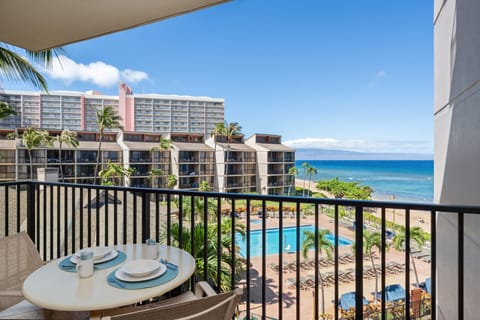 Relax on the private fourth-floor lanai with ocean, pool, and resort views.