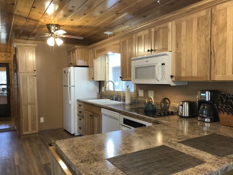 Appliances include fridge with ice maker, dishwasher, oven, microwave, coffee maker, all kitchen essentials for making your meals(pots, pans, dishes)