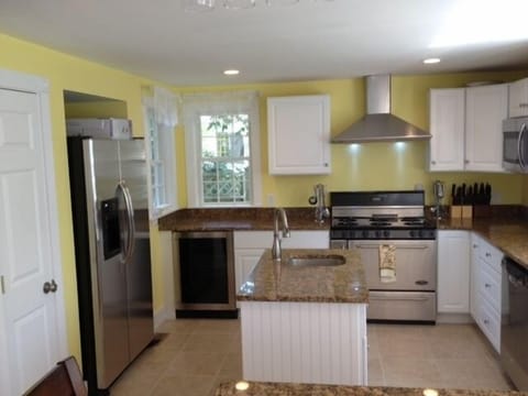 Chefs kitchen, granite, stainless, pantry, wine fridge, huge stove, island sink