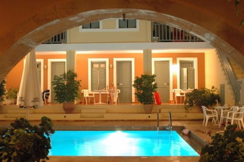 Outdoor pool, open 8:00 AM to 9:00 PM, pool umbrellas, sun loungers