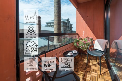 Coffee with a view: terrace + Rotermann architecture for calm mornings.