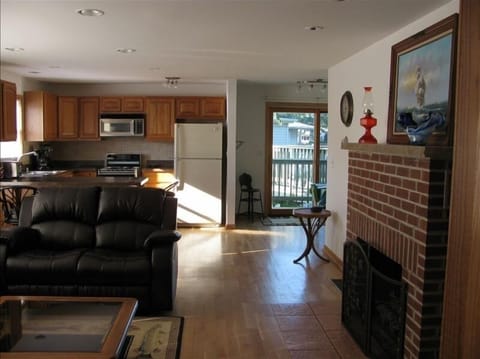 Straight view across the room showing the view of the deck and lake.