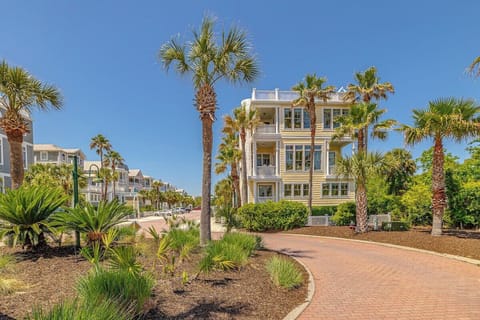 Side view of the property with pathway and landscaping