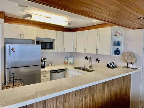 Kitchen with new cabinets and new quartz countertop. 