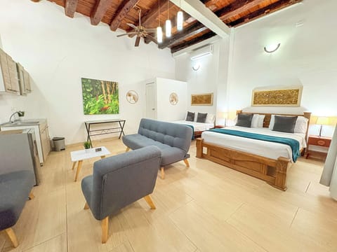 Comfort Studio Suite, Multiple Beds, Ground Floor | Minibar, in-room safe, individually decorated, individually furnished