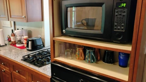 KITCHEN
The kitchen has a stove, microwave and oven.