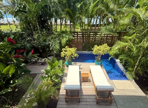 A private Caribbean oasis tucked between jungle palms and the sea.