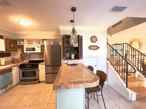 Freshly painted after opening up & removing walls. All tile downstairs