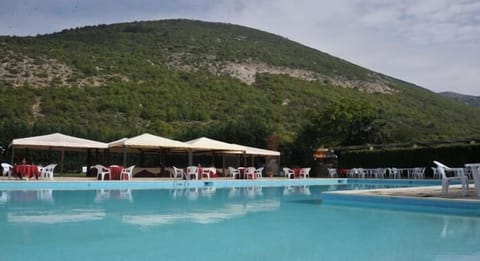 Outdoor pool, pool umbrellas, sun loungers