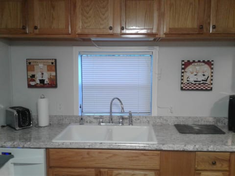 Kitchen with window view of campfire in distance