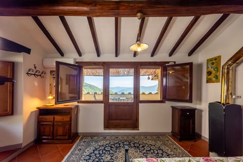 Terrace bedroom looking out to the veranda.