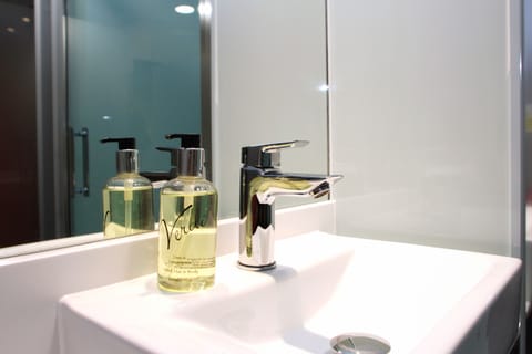 Shower, eco-friendly toiletries, towels, soap