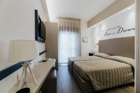 Superior Twin Room | Minibar, in-room safe, individually decorated, individually furnished