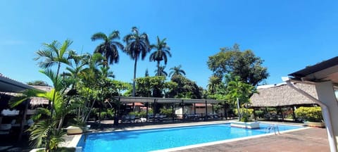 2 outdoor pools, open 7 AM to 10 PM, pool umbrellas