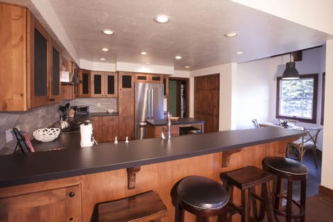 Seating for four at the breakfast bar, plus a sunny breakfast nook is tucked off the kitchen - seating for four with views of golf course. 