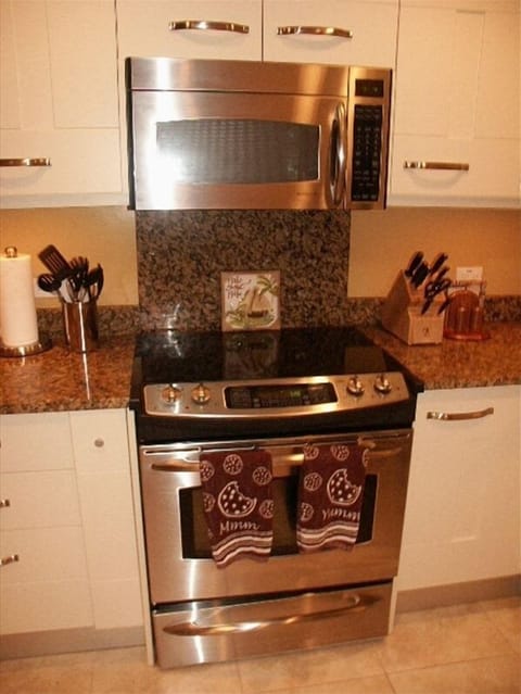 Glass cooktop, stainless steel stove, and microwave