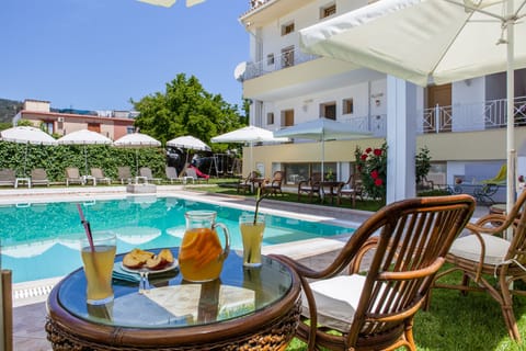 Outdoor pool, open 8 AM to 8 PM, pool umbrellas, sun loungers