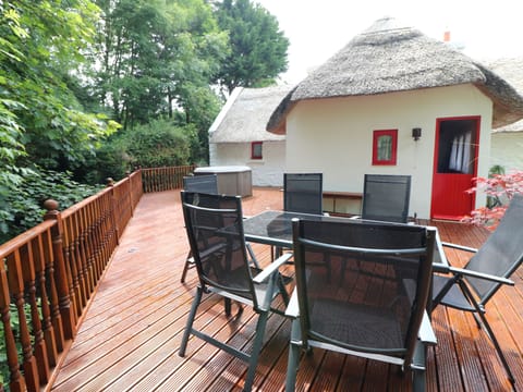 Deck overlooking the rushing stream below with a hot tub. Come and relax.