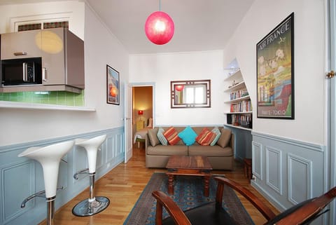 Living room with leather sofa that folds out to a double bed.