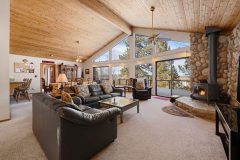 Expansive windows and sliding glass doors allow beautiful sunlight to pour in