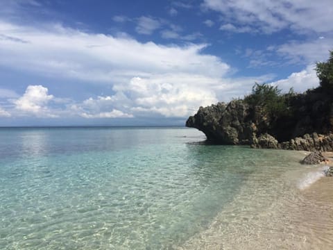 On the beach, white sand, free beach cabanas, sun loungers
