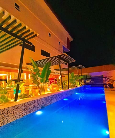 Outdoor pool, open 7:00 AM to 11:00 PM, pool umbrellas