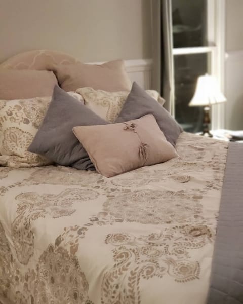 Plush bedding on memory foam queen mattress.