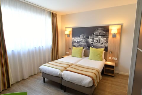 Cozy twin bedroom with soft light — a simple, relaxing space to relax.