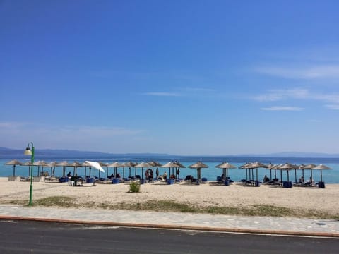On the beach, sun loungers, beach umbrellas